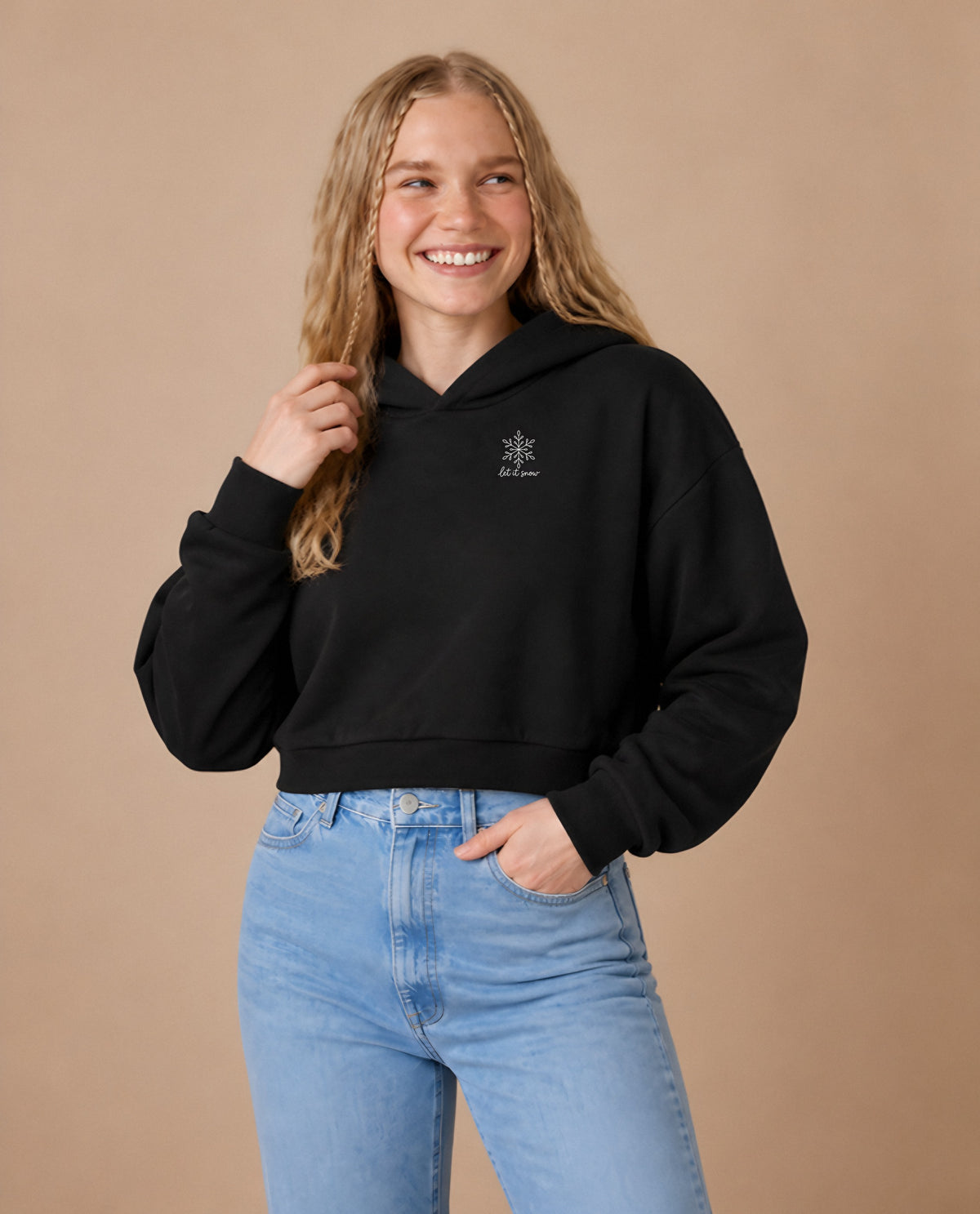 Let It Snow minimalist crop hoodie for women in Black, worn by model, studio photo