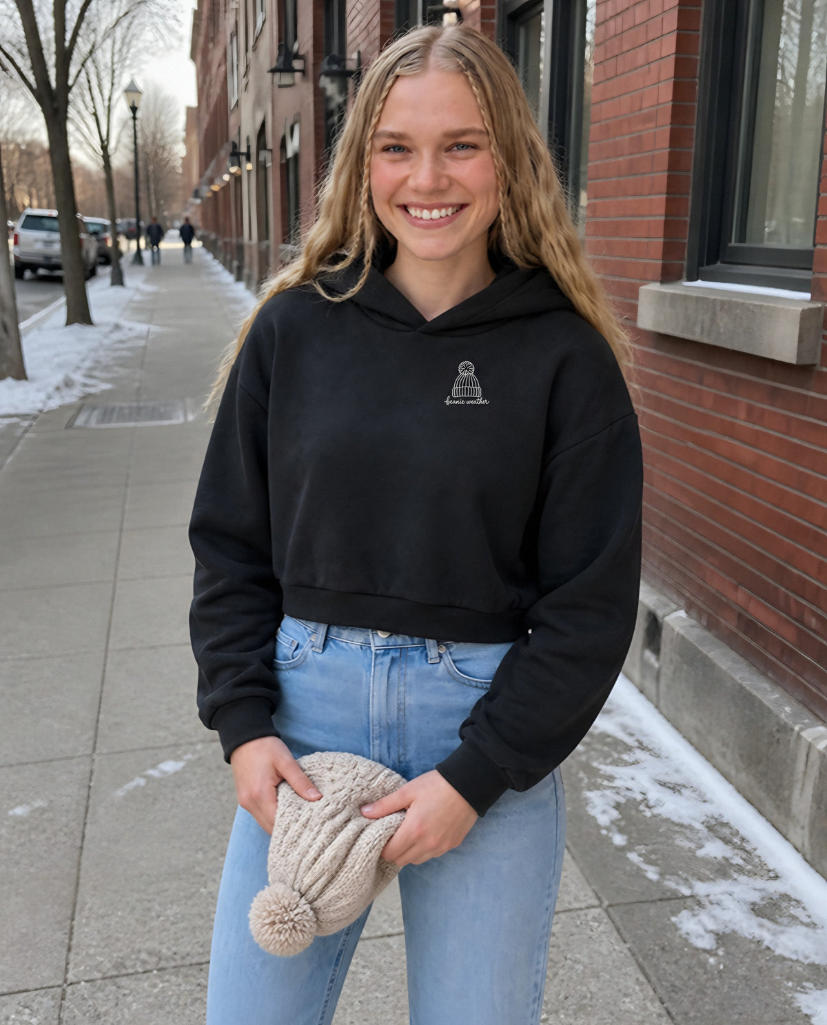 Beanie Weather minimalist crop hoodie for women in Black, worn by model, lifestyle photo