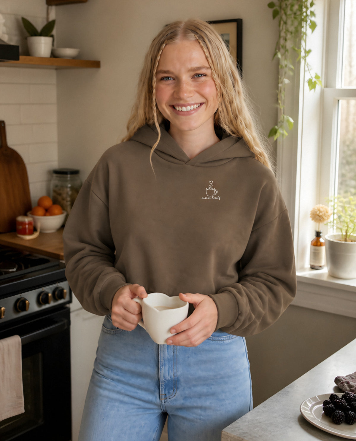 Warm Hearts minimalist crop hoodie for women in Coffee, worn by model, lifestyle photo