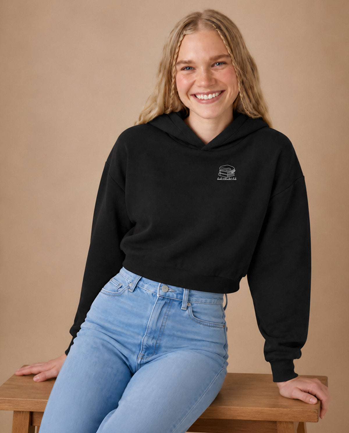 Book & Blanket Club minimalist crop hoodie for women in Black, worn by model, studio photo