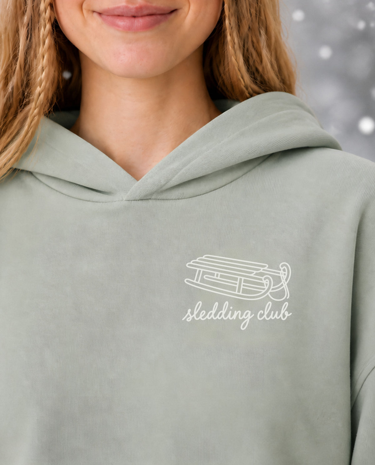 Sledding Club minimalist crop hoodie for women in Matcha, print close-up