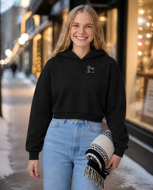 Wrapped in Warmth minimalist crop hoodie for women in Black, worn by model, lifestyle photo