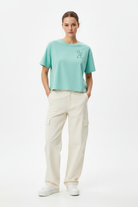 'Never Underestimate' Minimal Script Chest Tee — Mint, studio shot (Color: Chalky Mint)