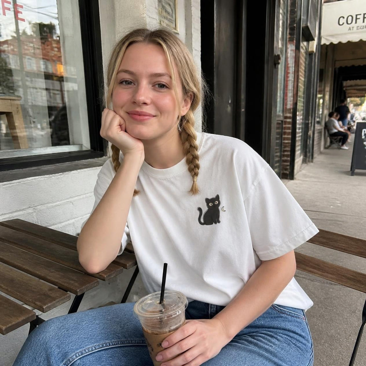 Woman wearing the white Black Cat boxy crop tee, lifestyle photo (Color: White)