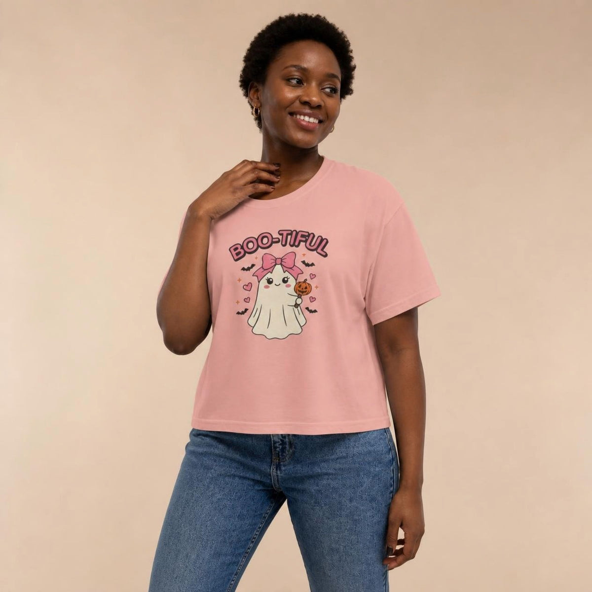 Model wearing the peachy Boo-tiful Ghost boxy crop tee, studio photo (Color: Peachy)