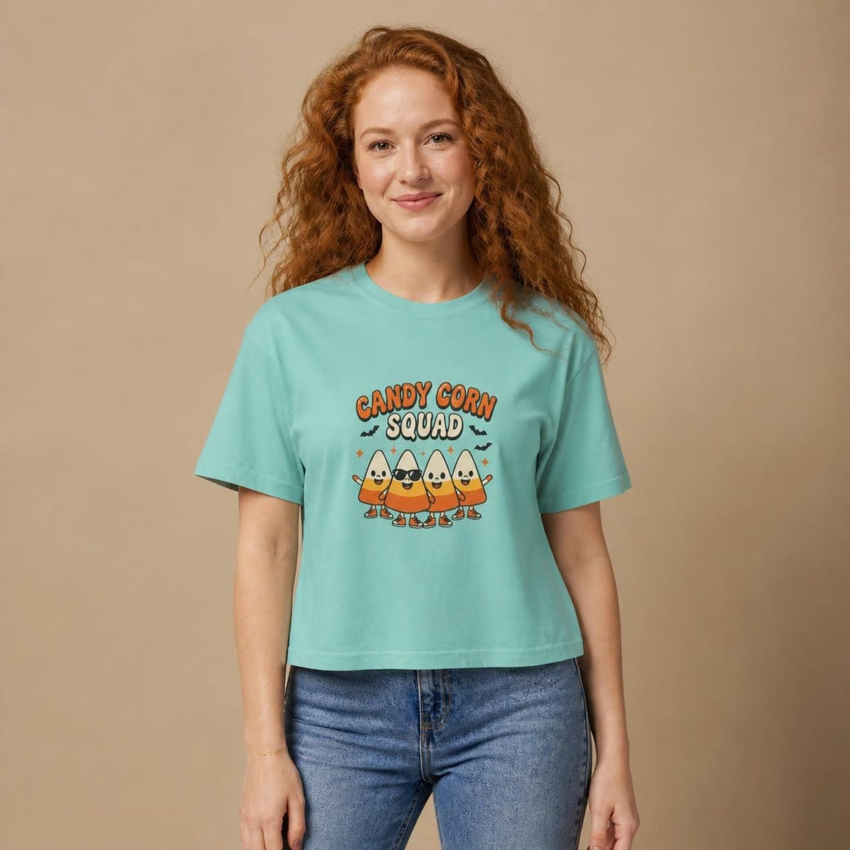 Model wearing the chalky mint Candy Corn Squad boxy crop tee, studio photo (Color: Chalky Mint)
