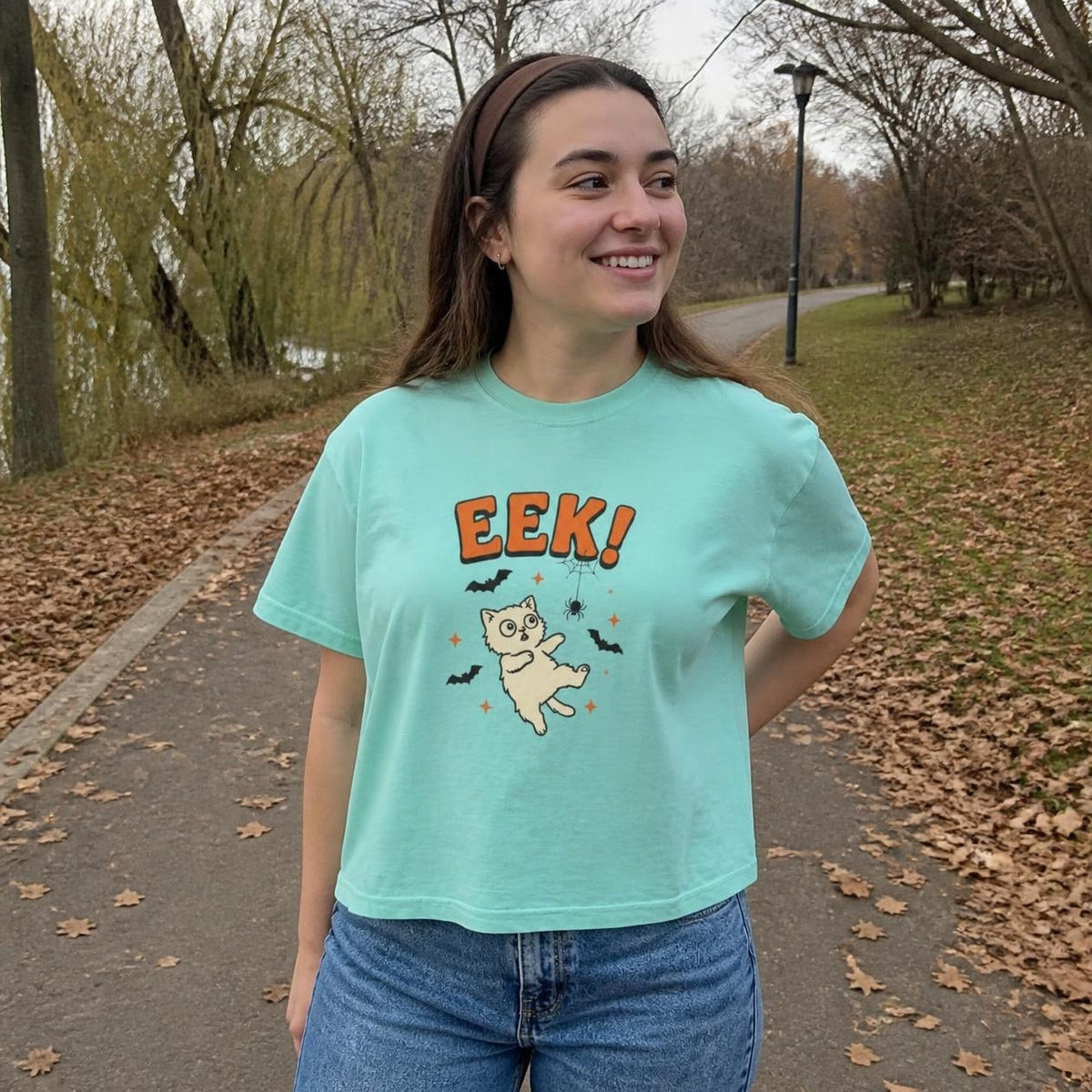 Woman wearing the chalky mint Eek! Scared Cat boxy crop tee, lifestyle photo (Color: Chalky Mint)