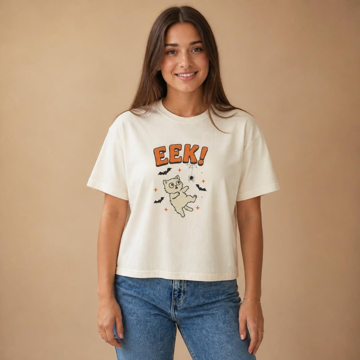 Model wearing the ivory Eek! Scared Cat boxy crop tee, studio photo (Color: Ivory)