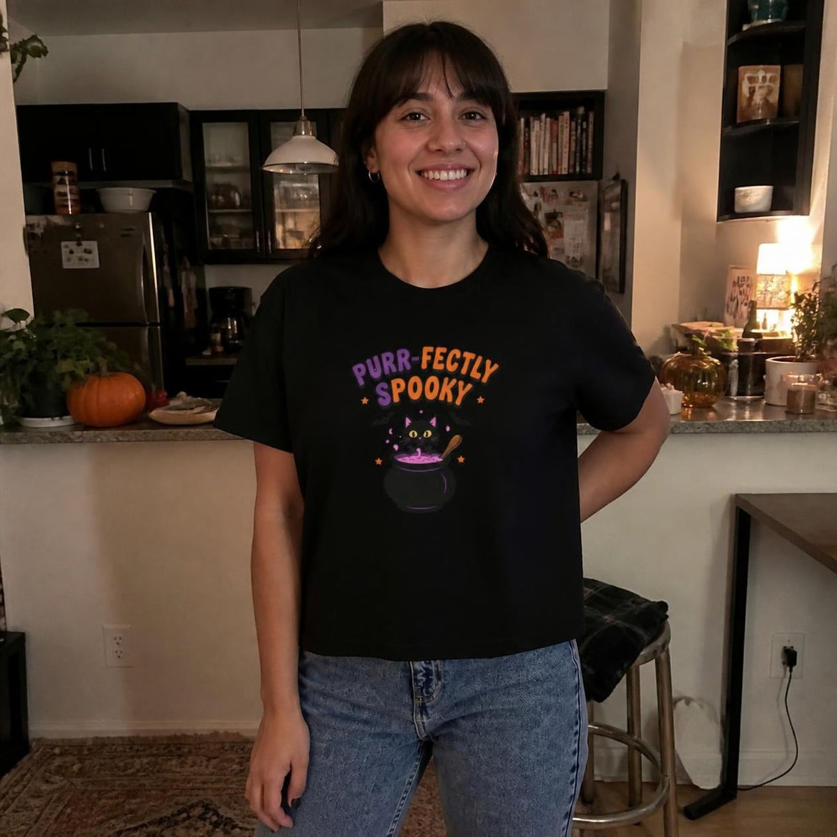 Woman wearing the black Purr-fectly Spooky Black Cat boxy crop tee, lifestyle photo (Color: Black)