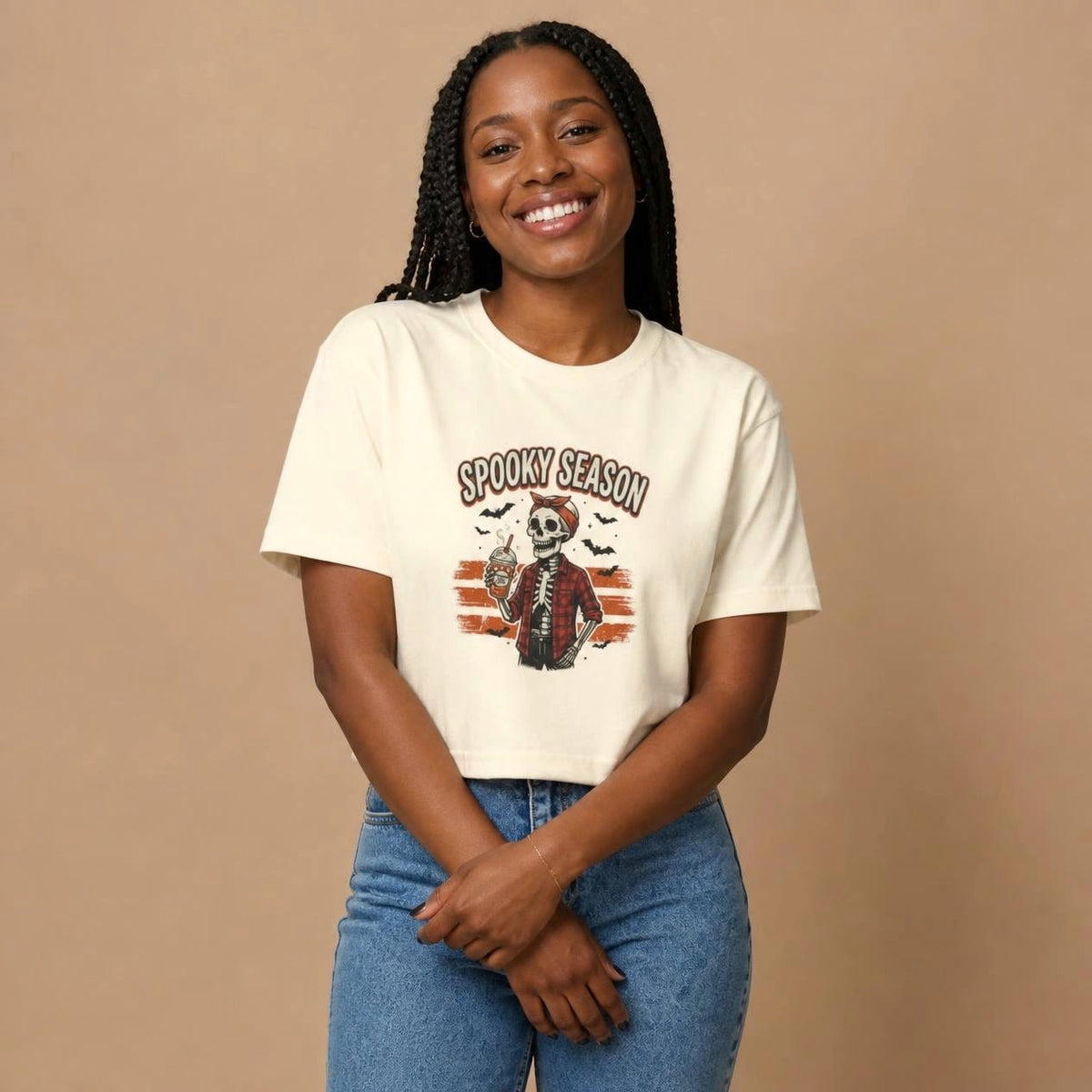 Model wearing the ivory Spooky Season Skeleton boxy crop tee, studio photo (Color: Ivory)