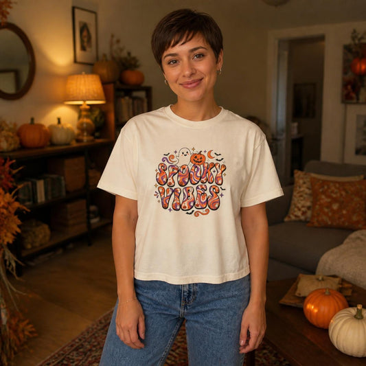 Woman wearing the ivory Spooky Vibes Retro boxy crop tee, lifestyle photo (Color: Ivory)