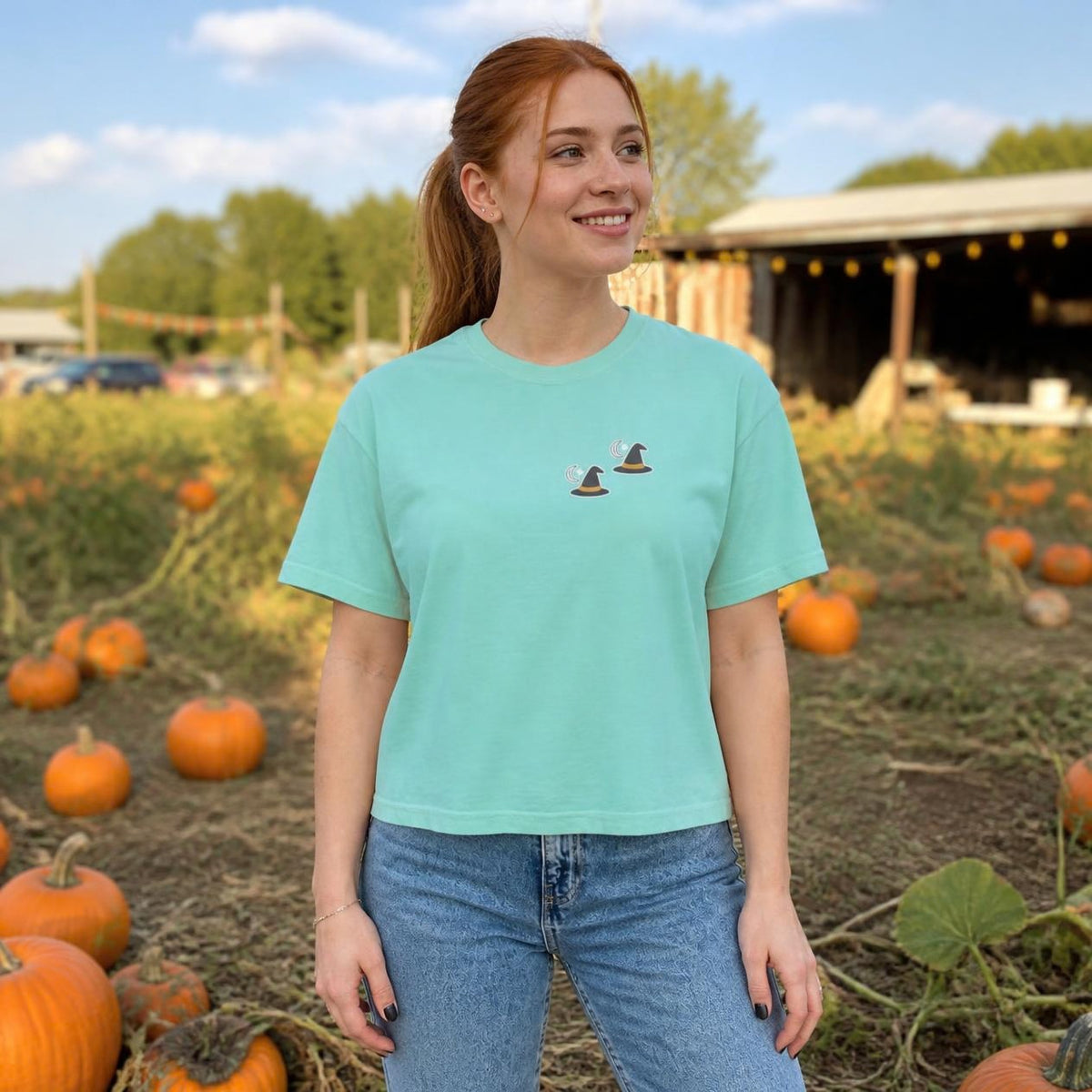 Woman wearing the chalky mint Witch Hat boxy crop tee, lifestyle photo (Color: Chalky Mint)