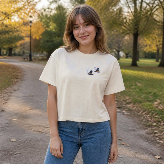 Woman wearing the ivory Witch Hat boxy crop tee, lifestyle photo (Color: Ivory)