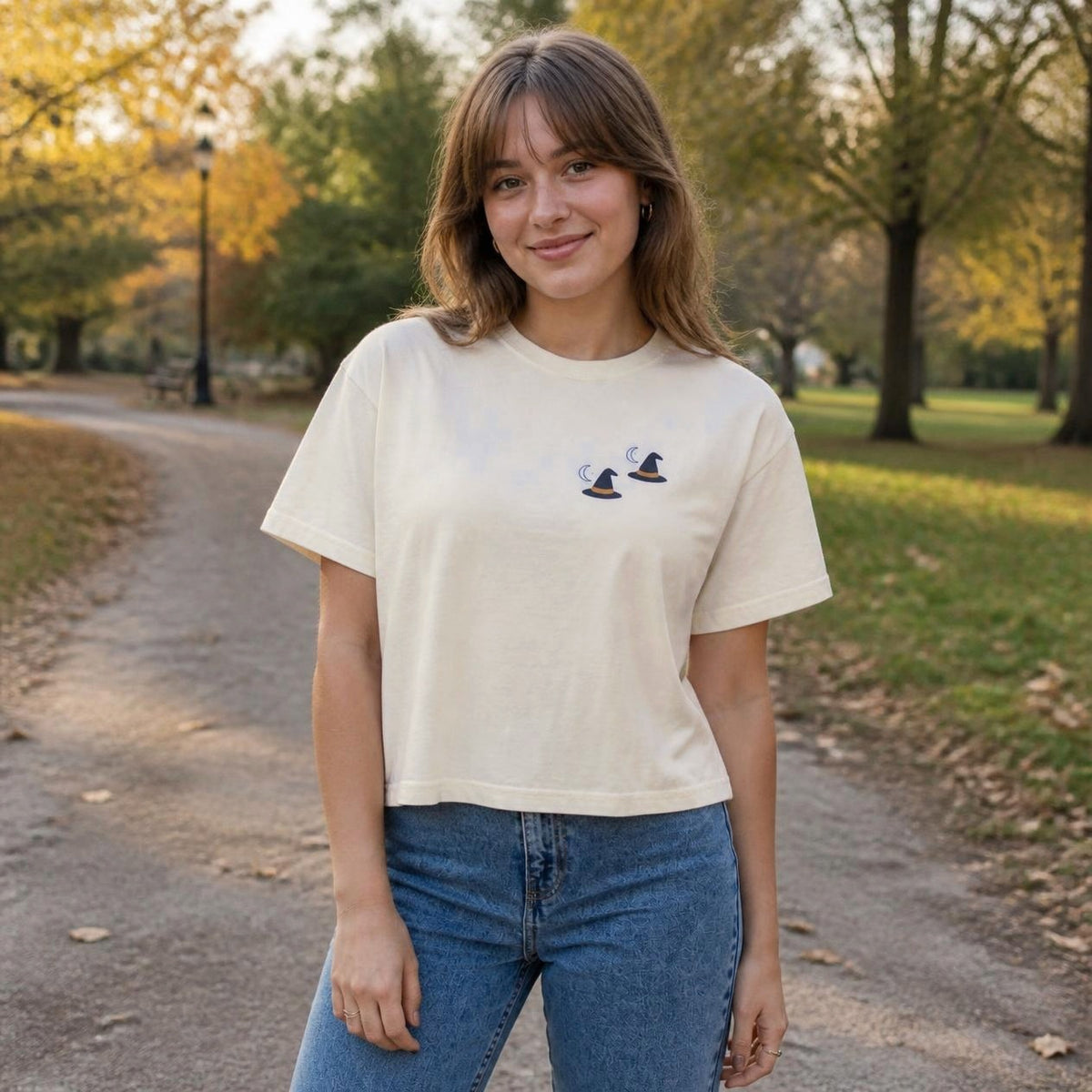Woman wearing the ivory Witch Hat boxy crop tee, lifestyle photo (Color: Ivory)