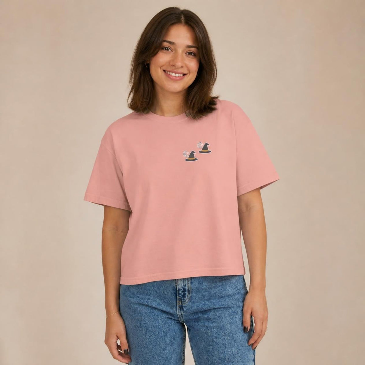 Model wearing the peachy Witch Hat boxy crop tee, studio photo (Color: Peachy)