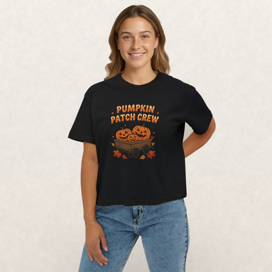 Pumpkin Patch Crew graphic tee with a wagon of jack-o'-lanterns on a black boxy crop tee
