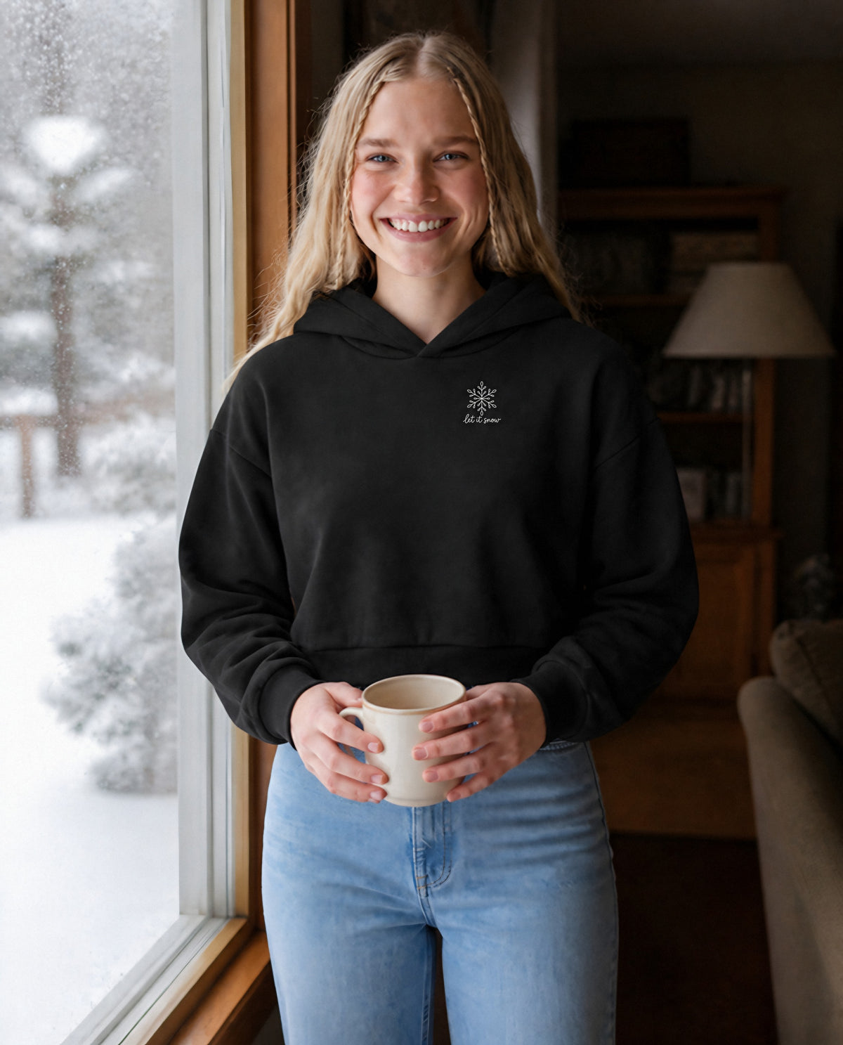 Let It Snow minimalist crop hoodie for women in Black, worn by model, lifestyle photo