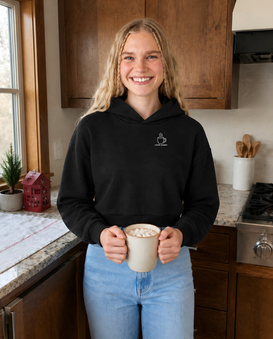Cocoa Season minimalist crop hoodie for women in Black, worn by model, lifestyle photo