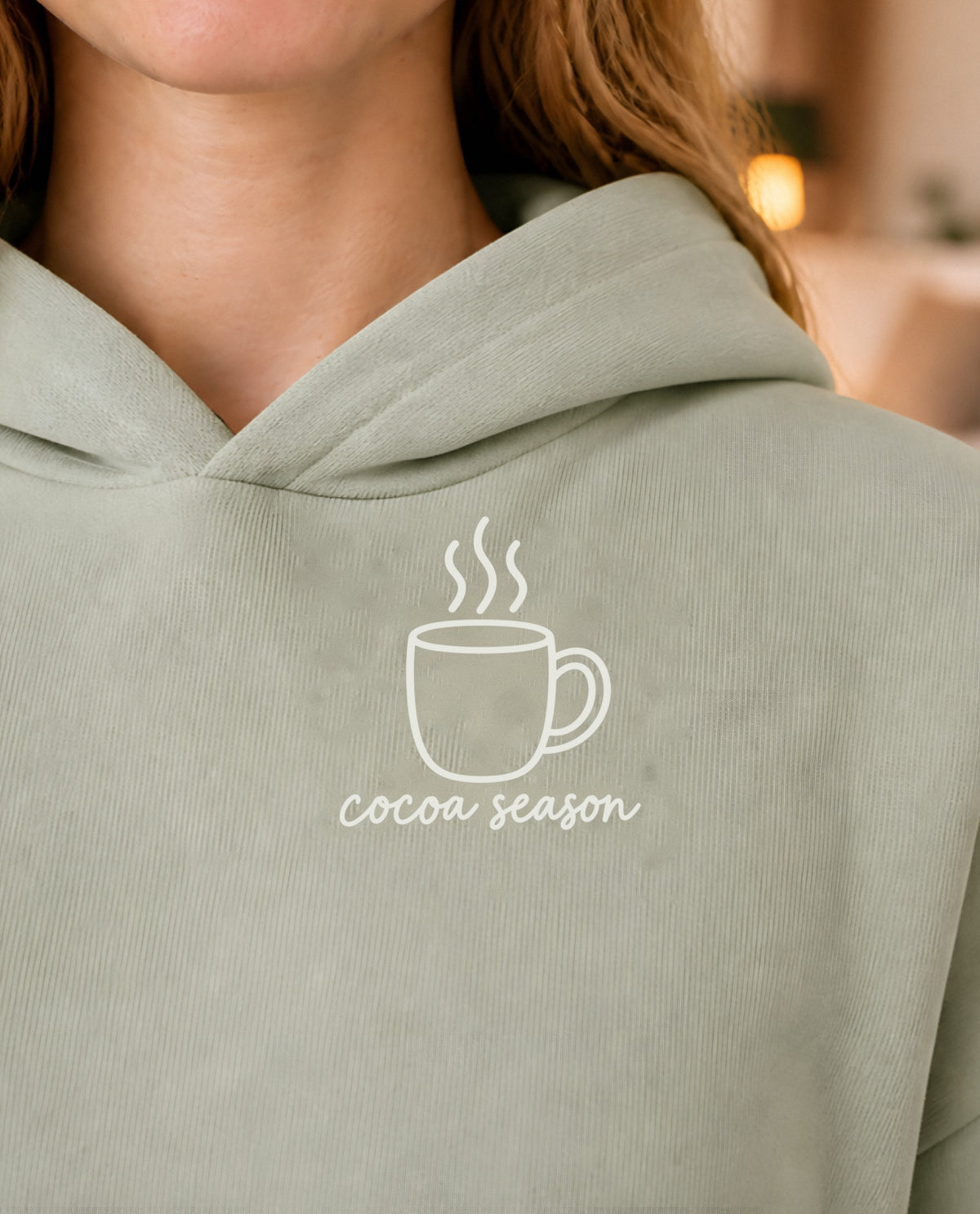 Cocoa Season minimalist crop hoodie for women in Matcha, print close-up