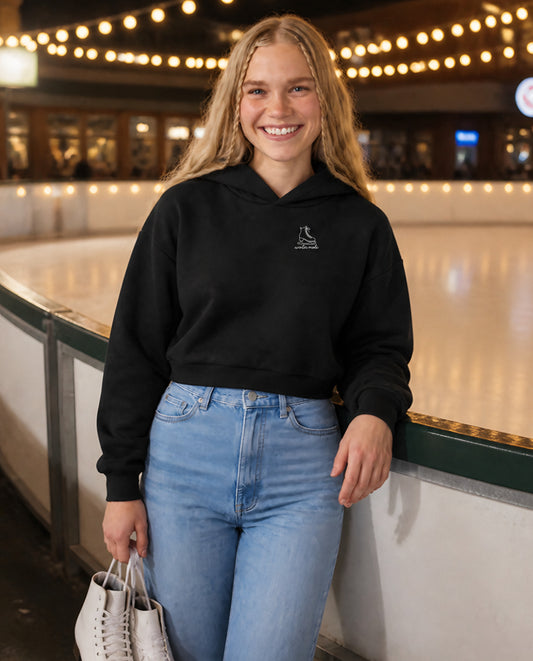 Winter Mode minimalist crop hoodie for women in Black, worn by model, lifestyle photo