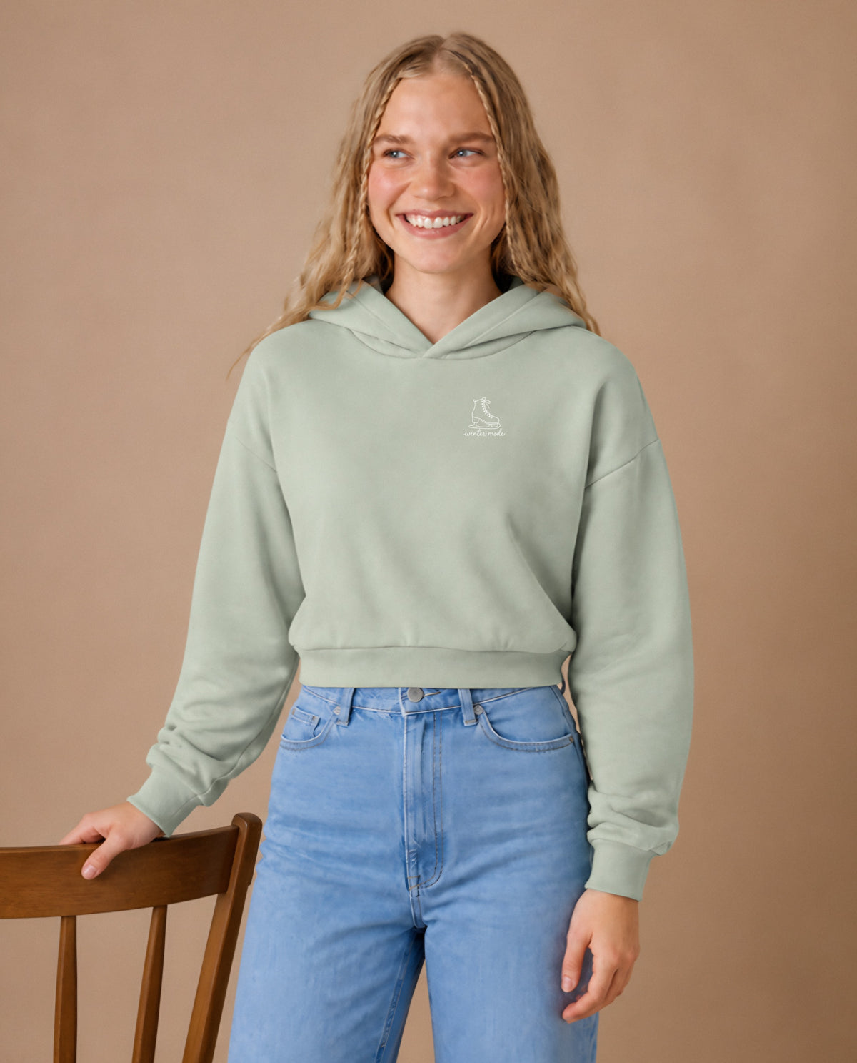 Winter Mode minimalist crop hoodie for women in Matcha, worn by model, studio photo