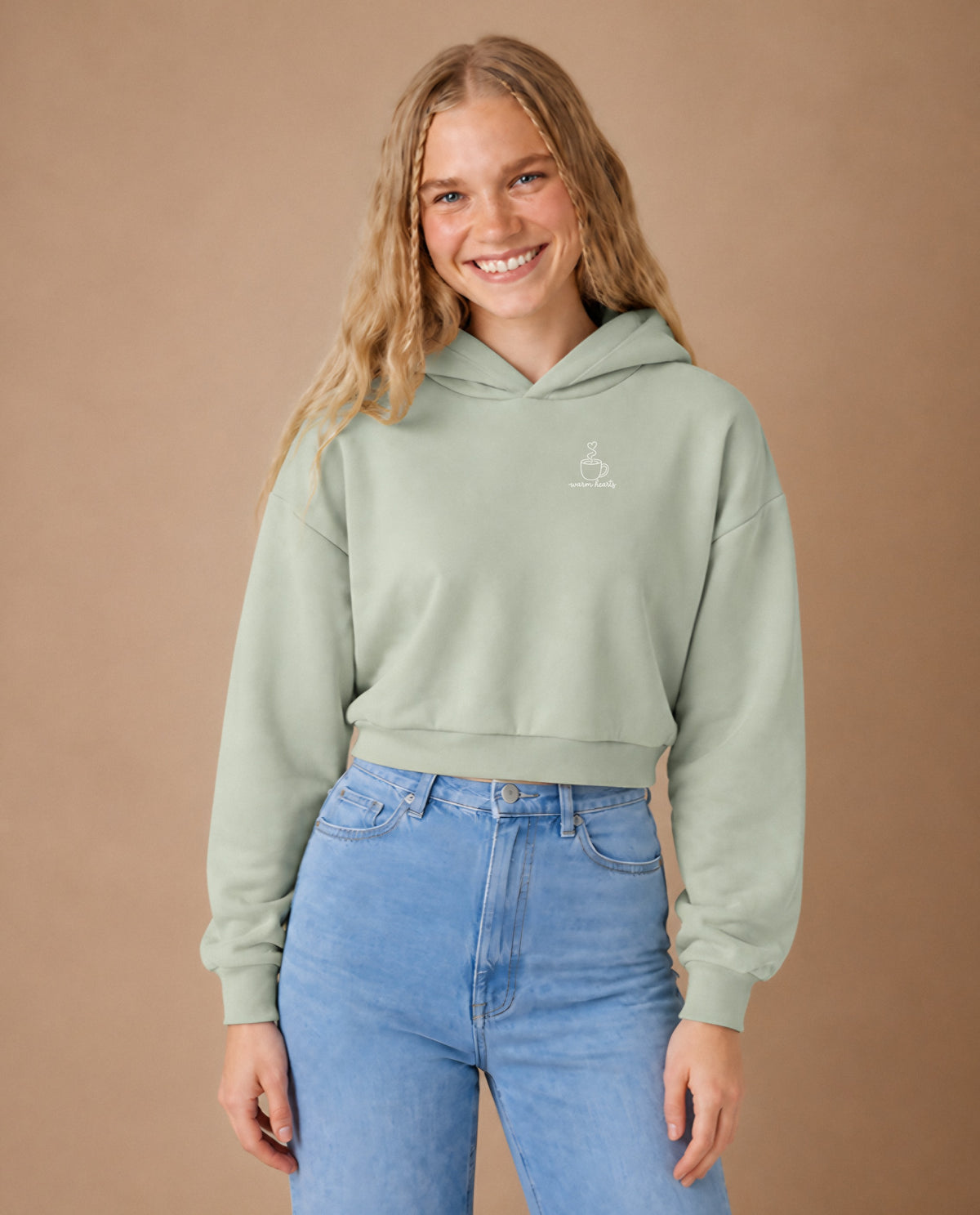 Warm Hearts minimalist crop hoodie for women in Matcha, worn by model, studio photo