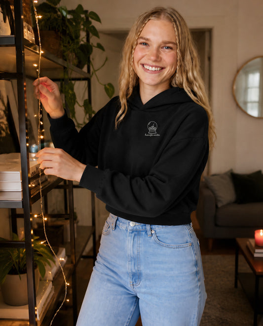 Home for Winter minimalist crop hoodie for women in Black, worn by model, lifestyle photo