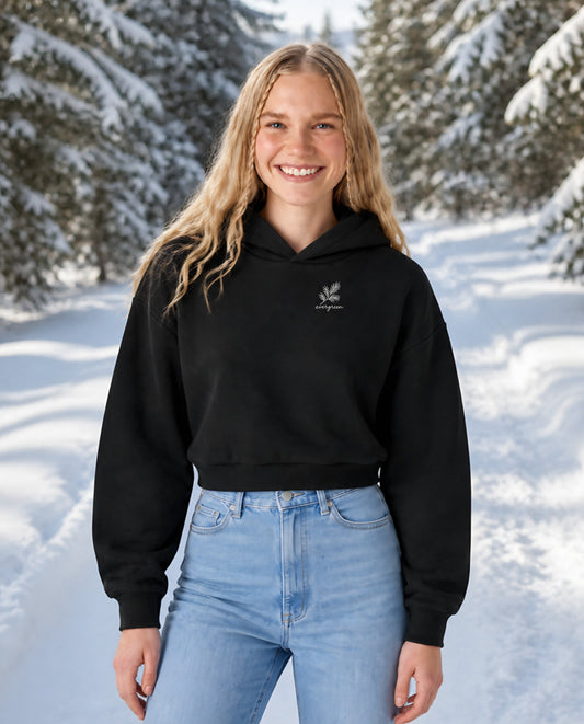 Evergreen minimalist crop hoodie for women in Black, worn by model, lifestyle photo
