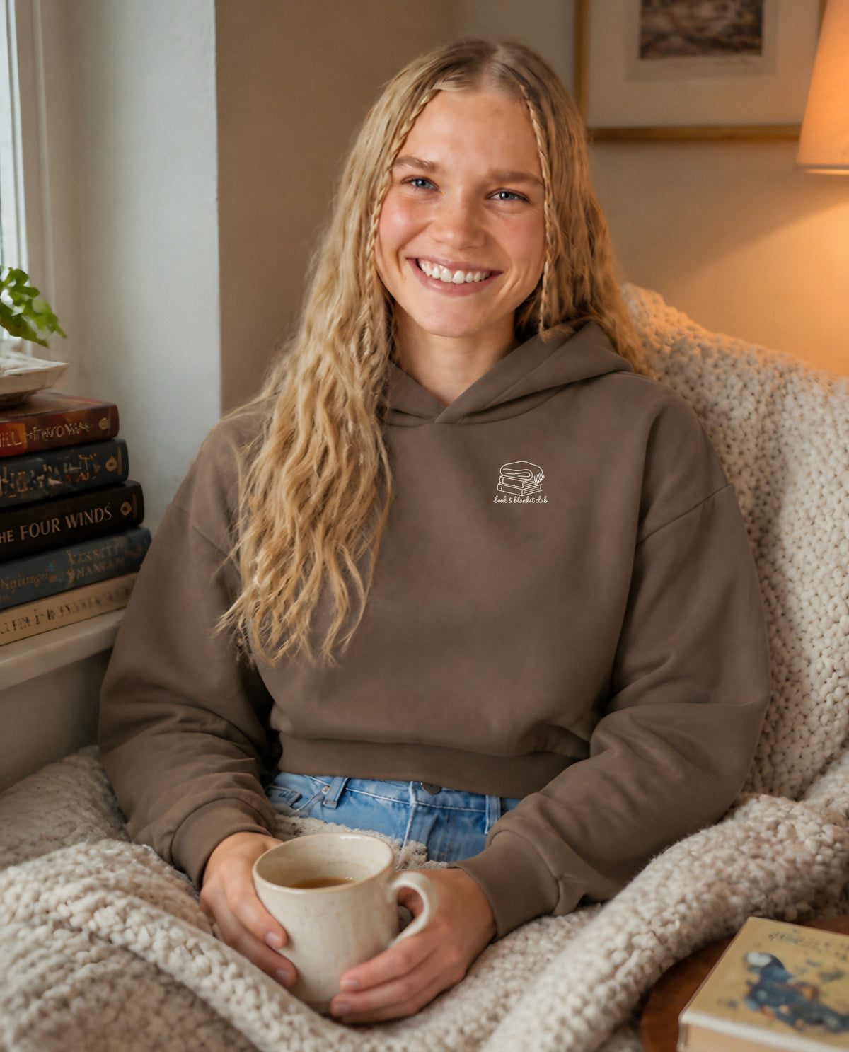 Book & Blanket Club minimalist crop hoodie for women in Coffee, worn by model, lifestyle photo