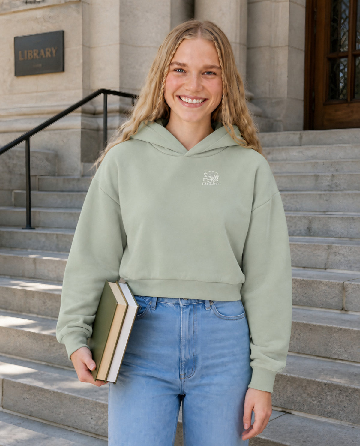 Book & Blanket Club minimalist crop hoodie for women in Matcha, worn by model, lifestyle photo