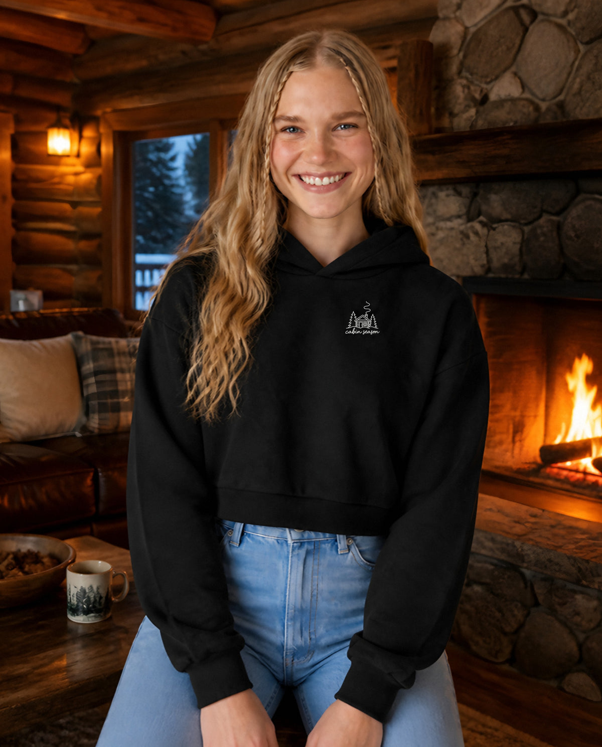 Cabin Season minimalist crop hoodie for women in Black, worn by model, lifestyle photo