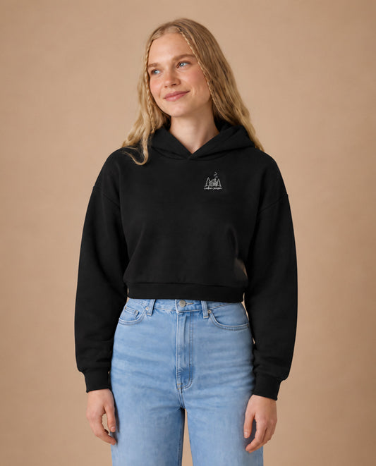 Cabin Season minimalist crop hoodie for women in Black, worn by model, studio photo