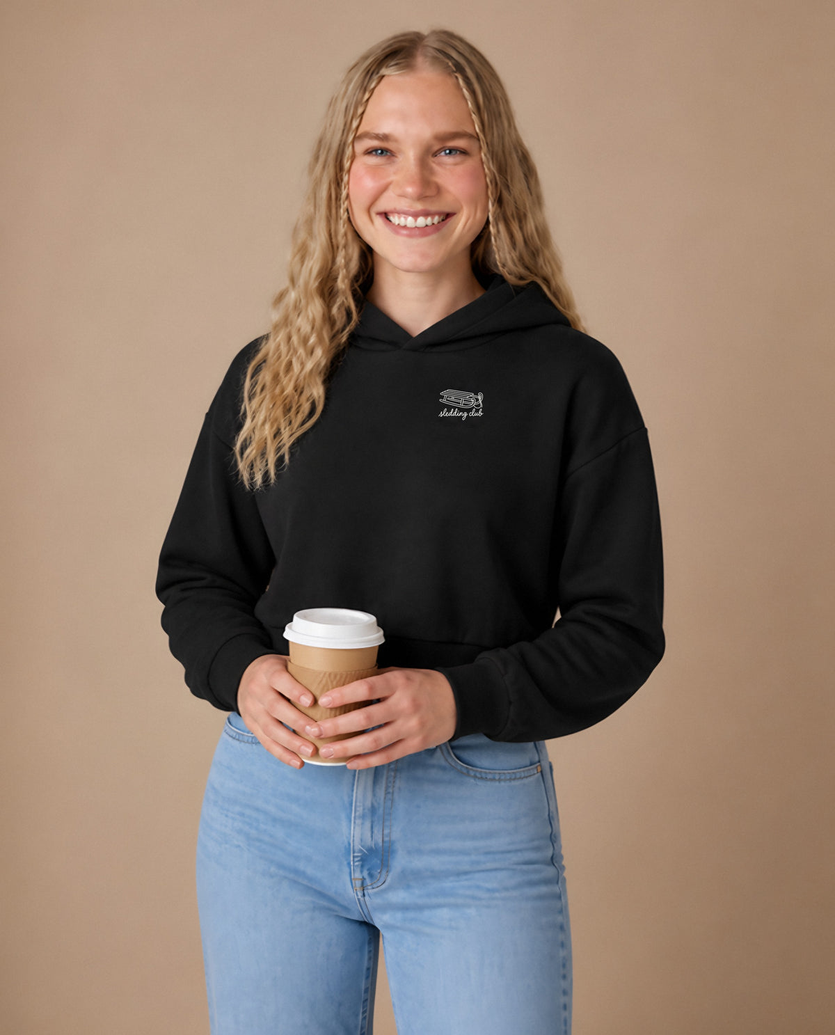 Sledding Club minimalist crop hoodie for women in Black, worn by model, studio photo