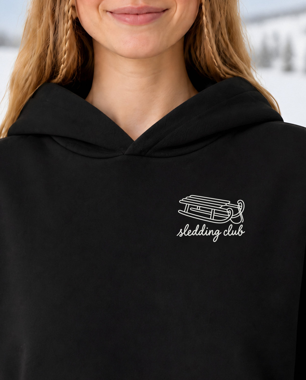 Sledding Club minimalist crop hoodie for women in Black, print close-up