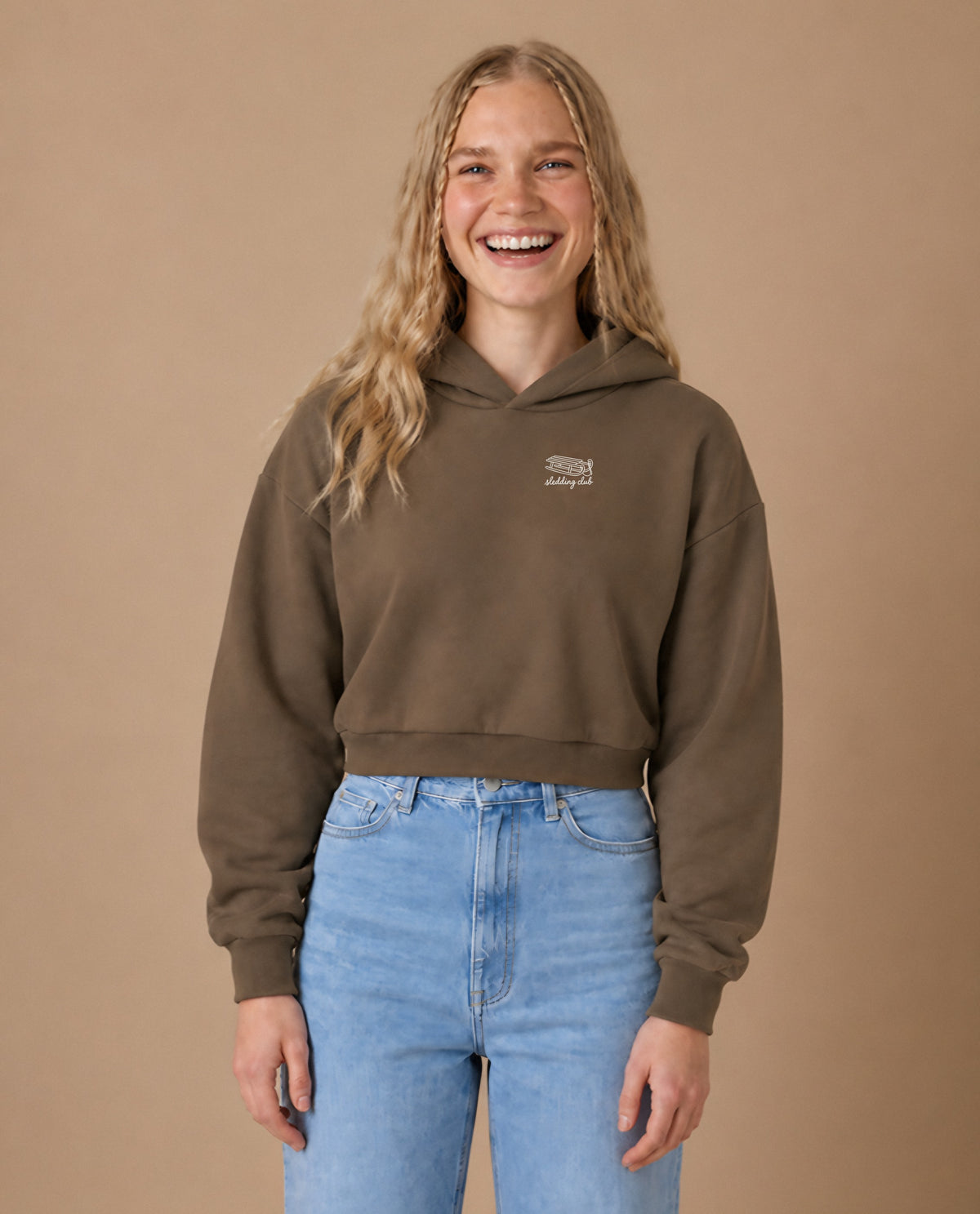 Sledding Club minimalist crop hoodie for women in Coffee, worn by model, studio photo