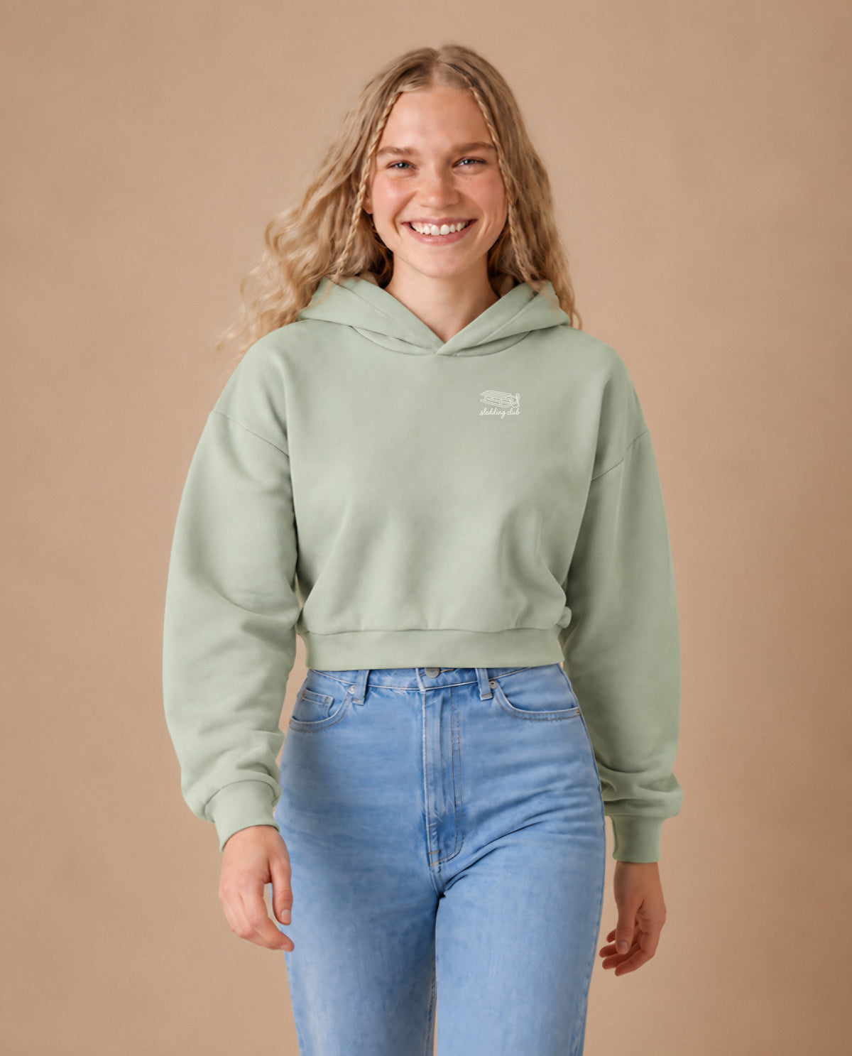 Sledding Club minimalist crop hoodie for women in Matcha, worn by model, studio photo