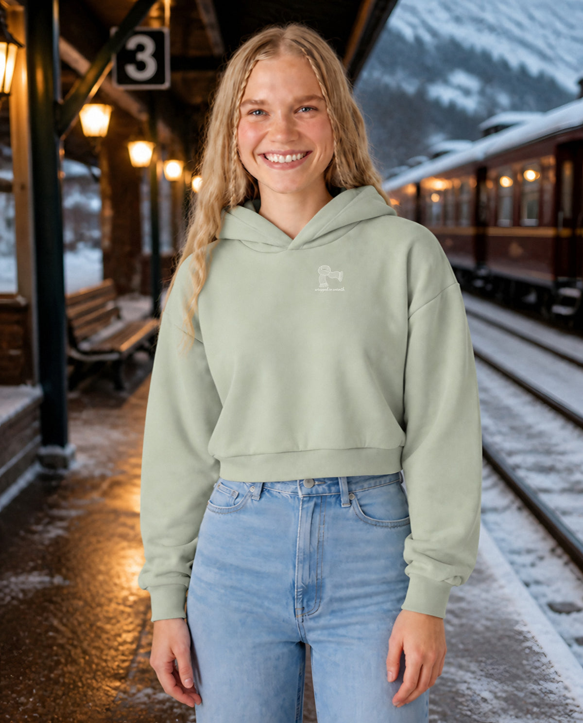 Wrapped in Warmth minimalist crop hoodie for women in Matcha, worn by model, lifestyle photo