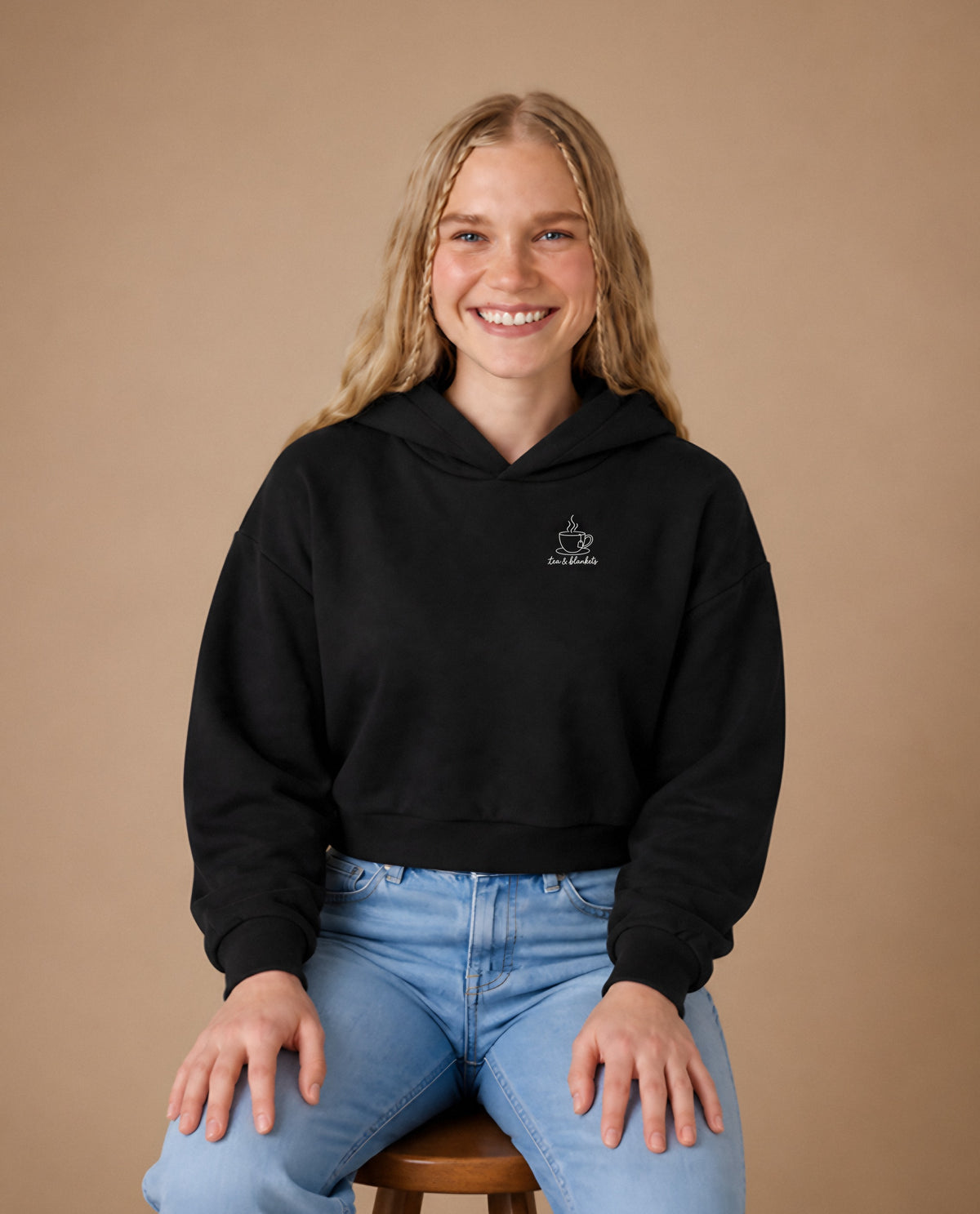 Tea & Blankets minimalist crop hoodie for women in Black, worn by model, studio photo