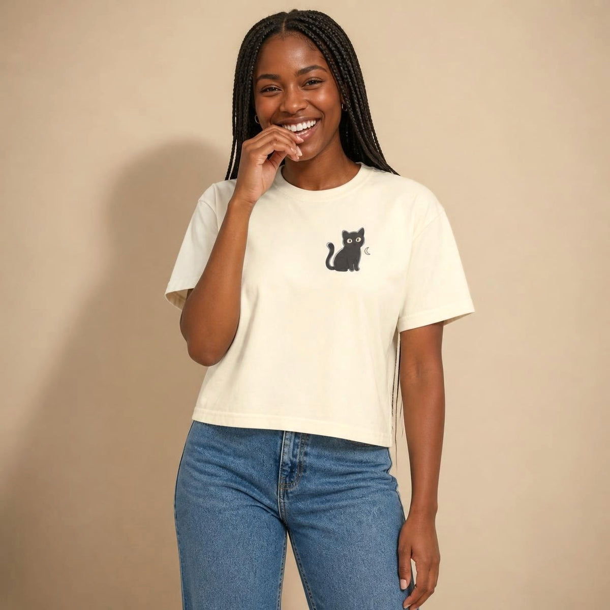 Model wearing the ivory Black Cat boxy crop tee, studio photo (Color: Ivory)