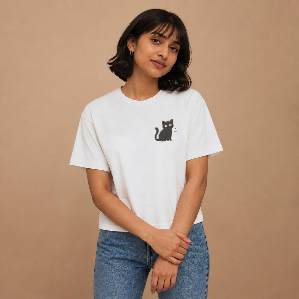 Model wearing the white Black Cat boxy crop tee, studio photo (Color: White)