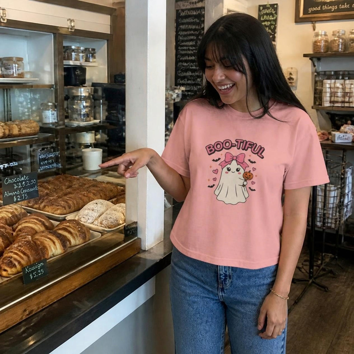 Woman wearing the peachy Boo-tiful Ghost boxy crop tee, lifestyle photo (Color: Peachy)
