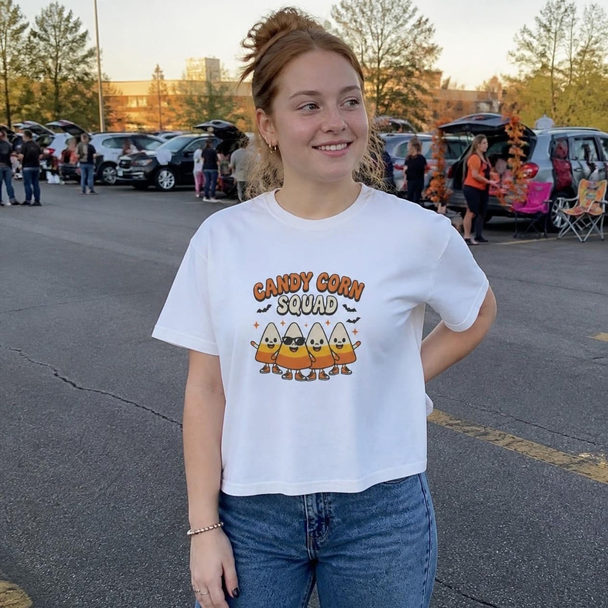 Woman wearing the white Candy Corn Squad boxy crop tee, lifestyle photo (Color: White)