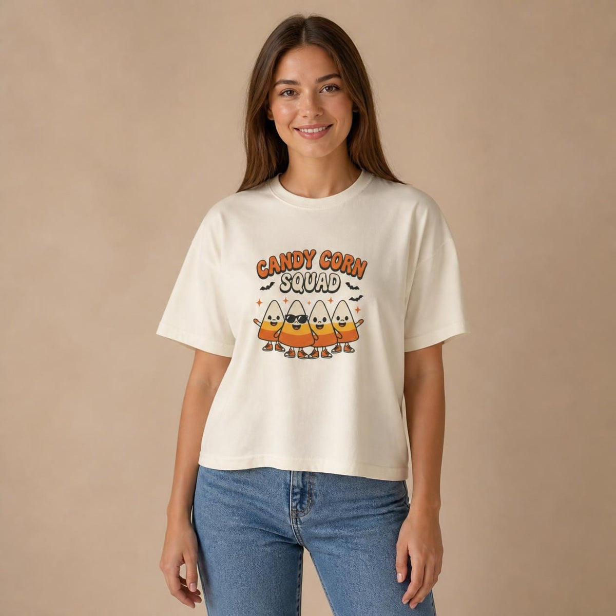 Model wearing the ivory Candy Corn Squad boxy crop tee, studio photo (Color: Ivory)