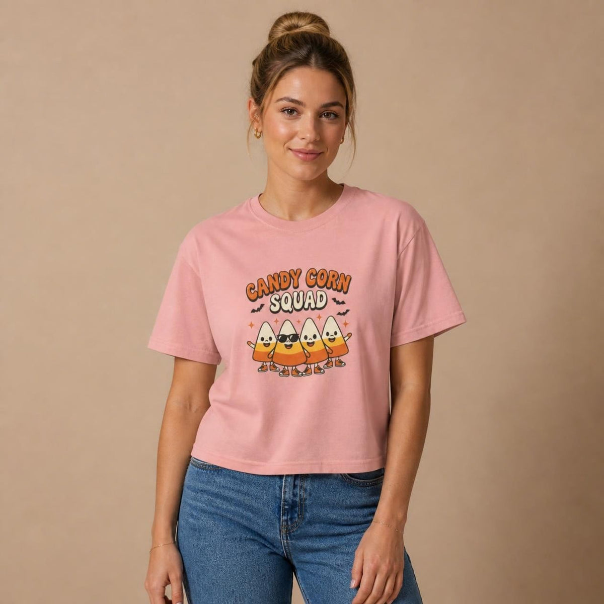 Model wearing the peachy Candy Corn Squad boxy crop tee, studio photo (Color: Peachy)