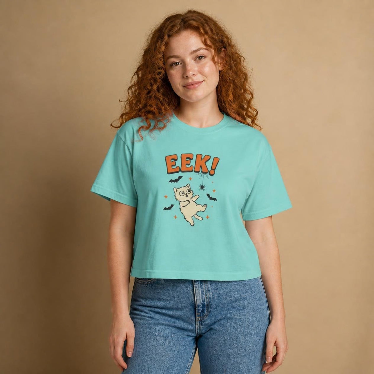 Model wearing the chalky mint Eek! Scared Cat boxy crop tee, studio photo (Color: Chalky Mint)
