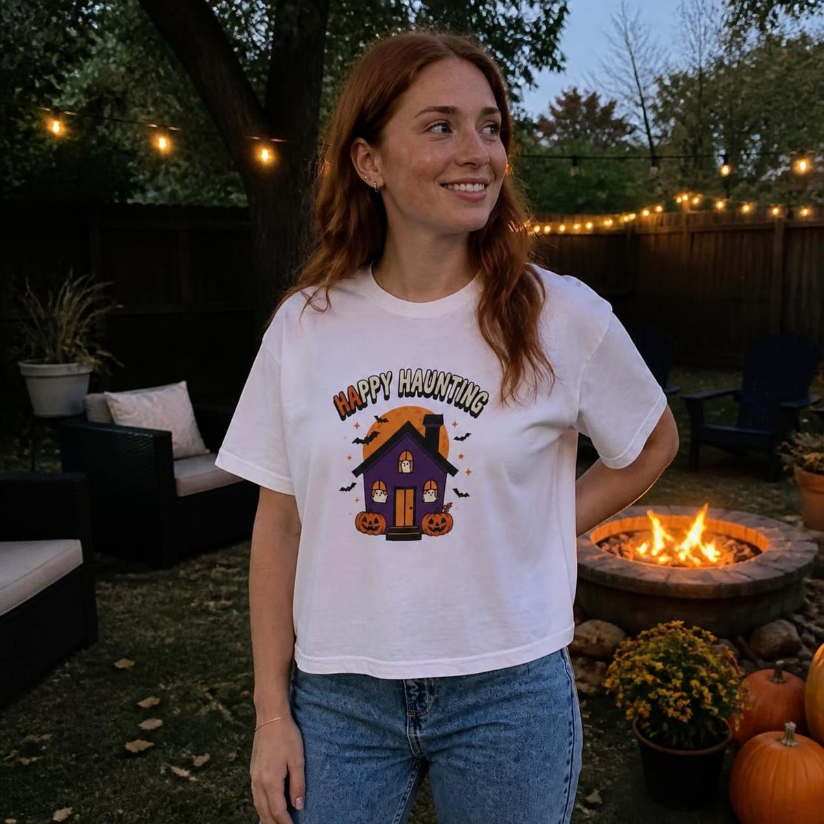 Woman wearing the white Happy Haunting Haunted House boxy crop tee, lifestyle photo (Color: White)
