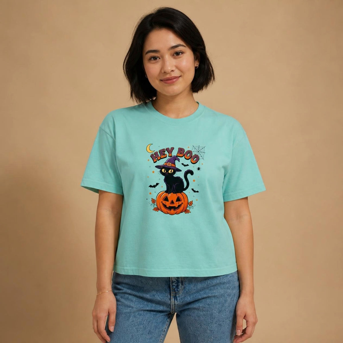 Model wearing the chalky mint Hey Boo Black Cat boxy crop tee, studio photo (Color: Chalky Mint)