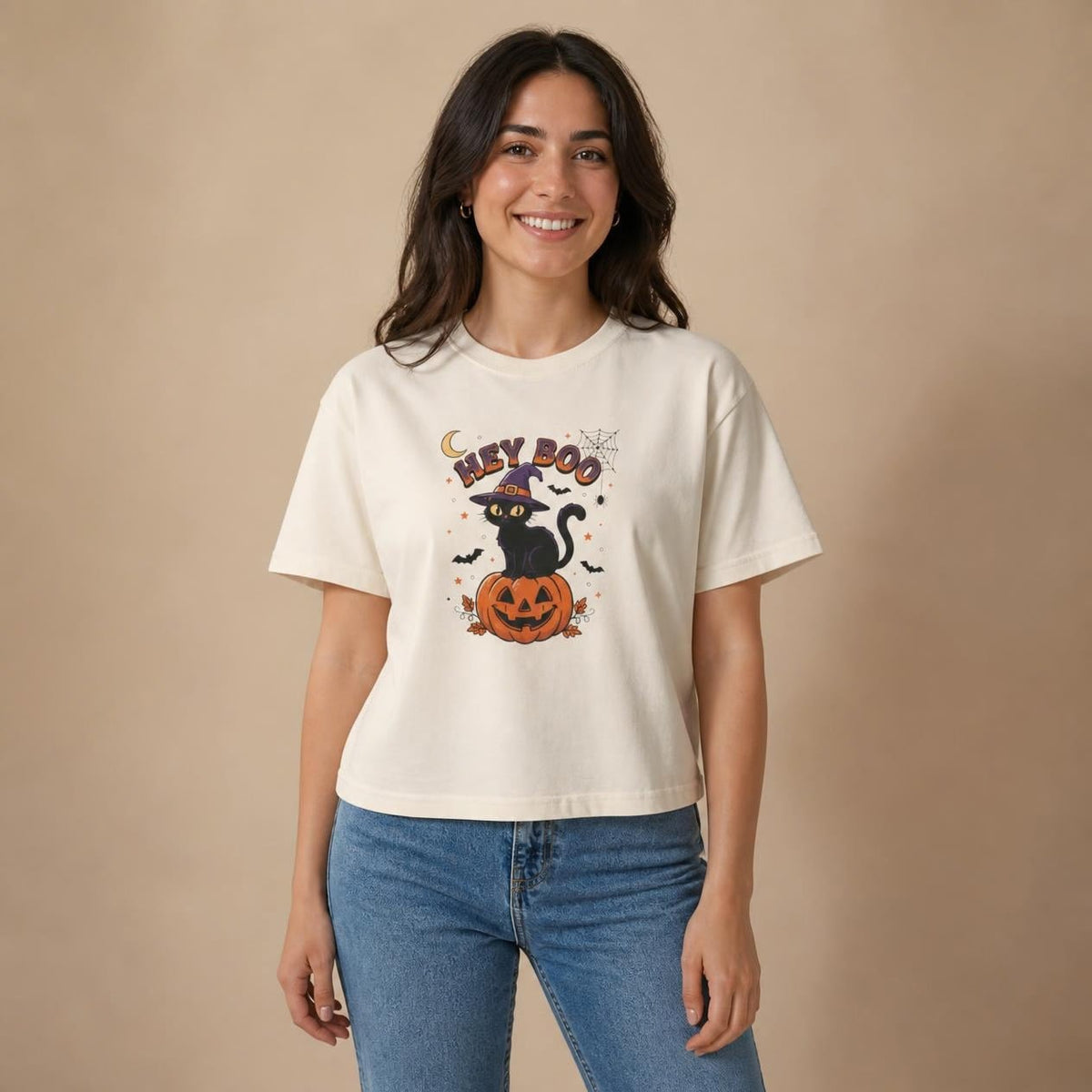 Model wearing the ivory Hey Boo Black Cat boxy crop tee, studio photo (Color: Ivory)