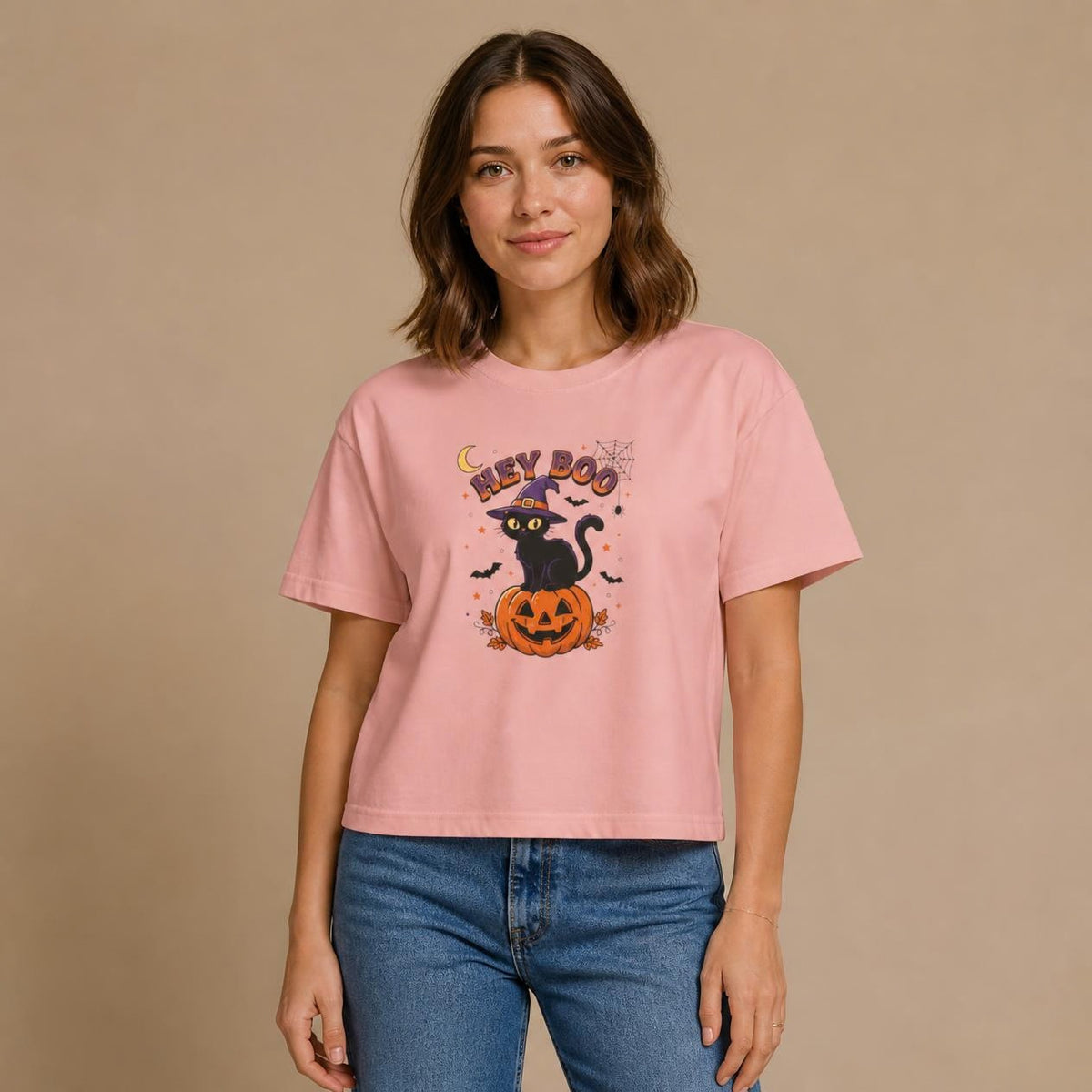 Model wearing the peachy Hey Boo Black Cat boxy crop tee, studio photo (Color: Peachy)