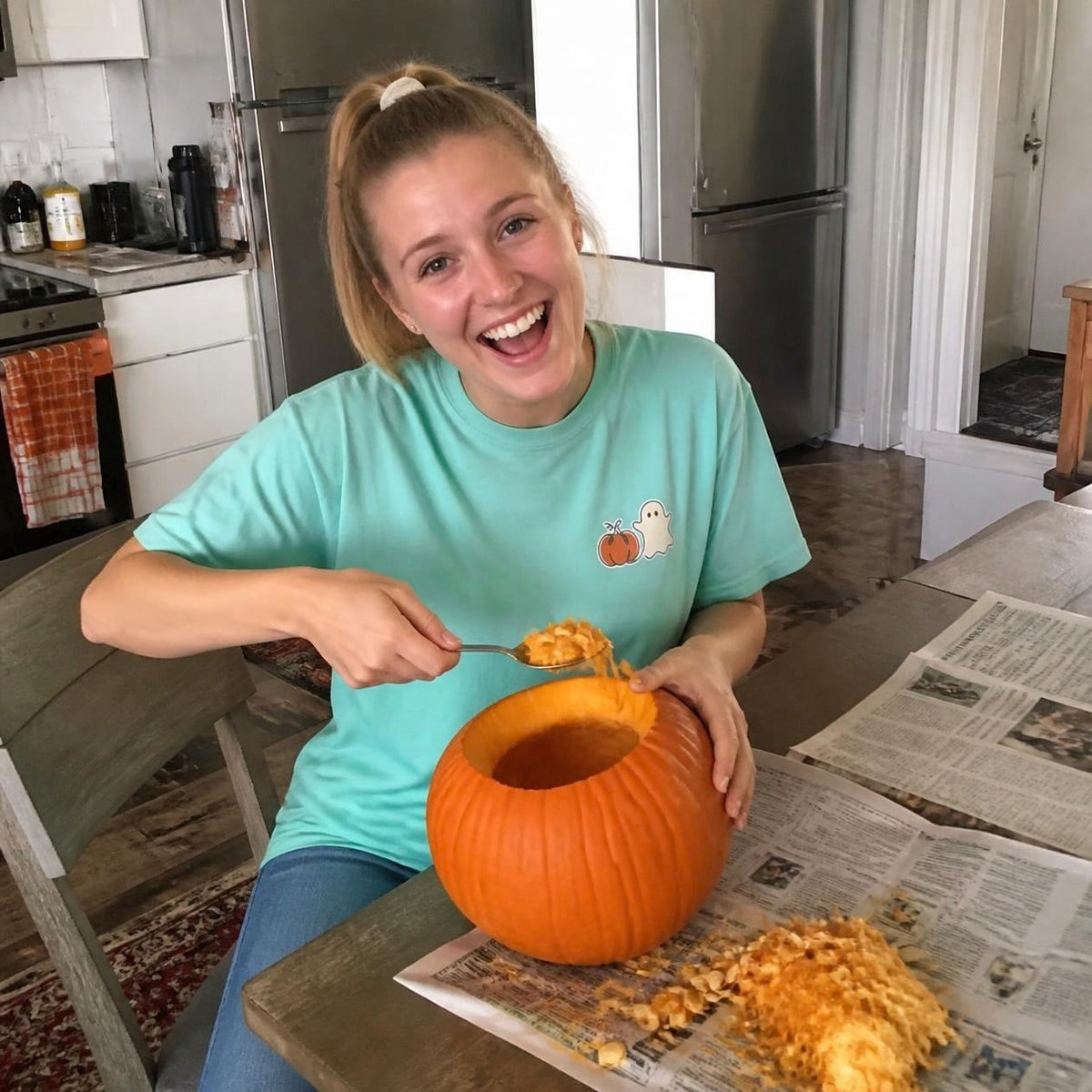 Woman wearing the chalky mint Pumpkin Ghost boxy crop tee, lifestyle photo (Color: Chalky Mint)